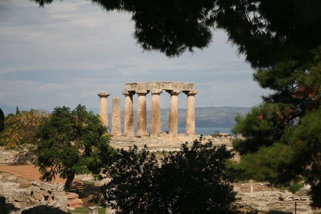 Ancient Corinth - Temple of Apollo with the gulf of Corinth in the background